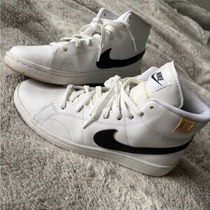Nike White Mid-Top Sneakers with Black Swoosh and Gold Tab